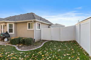 View of home's exterior with a yard