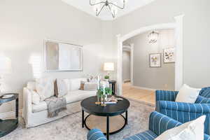 Living room featuring hardwood / wood-style flooring and ornamental molding