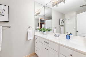 Bathroom featuring vanity and walk in shower