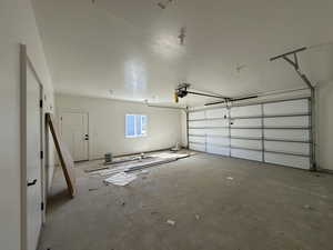 Garage featuring a garage door opener