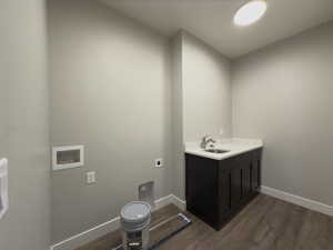 Bathroom with vanity and hardwood / wood-style floors