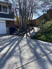 View of property exterior featuring a garage