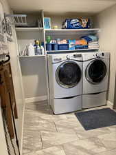 Washroom with washing machine and dryer