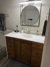 Bathroom with hardwood / wood-style floors and vanity