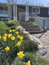 View of front of home featuring a garage and covered porch