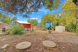 View of yard with a storage shed