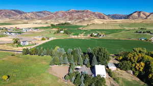 Birds eye view of property with a rural view and a water and mountain view