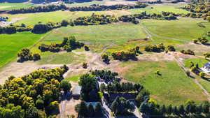 Birds eye view of property featuring a rural view