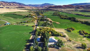 Drone / aerial view featuring a mountain view and a rural view