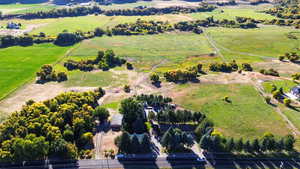 Birds eye view of property with a rural view