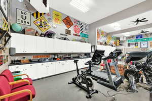 Exercise area featuring ceiling fan