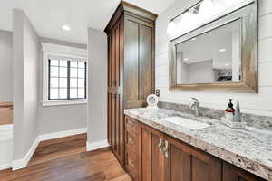 Bathroom featuring wood-type flooring and vanity