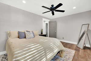 Bedroom featuring ceiling fan and hardwood / wood-style floors