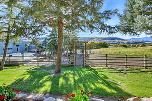 View of yard featuring a mountain view and a rural view