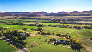 Birds eye view of property featuring a mountain view and a rural view