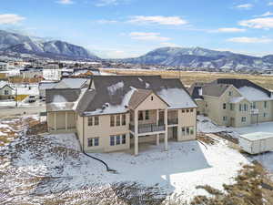 Snowy aerial view with a mountain view