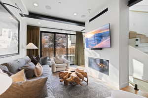 Living room with light hardwood / wood-style floors