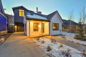 Modern inspired farmhouse with covered porch and a garage