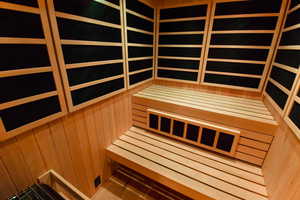 View of sauna / steam room featuring wooden walls