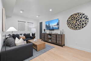 Living room with wood-type flooring