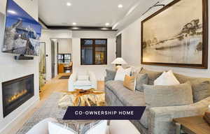 Living room with light hardwood / wood-style flooring