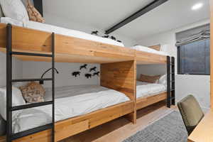 Bedroom with wood-type flooring