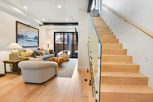 Staircase with hardwood / wood-style flooring