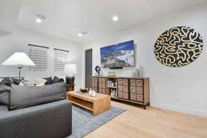 Living room with hardwood / wood-style floors