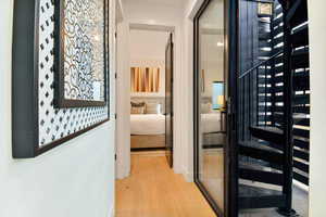 Corridor featuring light hardwood / wood-style floors