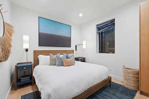 Bedroom featuring wood-type flooring