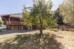 View of yard featuring a wooden deck