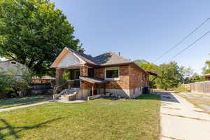 View of front of property with a front lawn