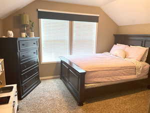 Cozy 2nd bedroom with charming slanted ceilings and a large closet