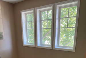 Large windows on the stairway provide natural light and a beautiful mountain view