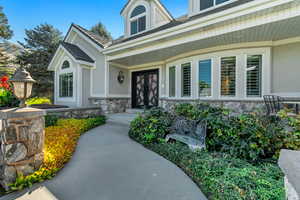 View of exterior entry with a porch