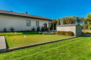 View of yard featuring a shed