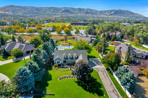 Birds eye view of property with a mountain view