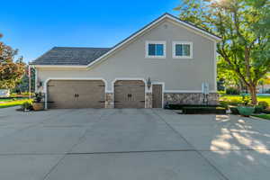 View of side of home w/ 3 car garage