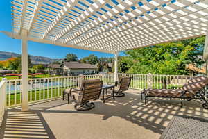 View of patio / terrace off of Master Bedroom featuring a pergola and a mountain view