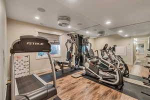 Gym featuring hardwood / LVP floors