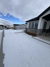 View of yard covered in snow