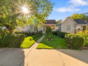 View of front of house with a front yard