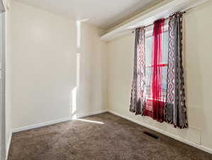 Empty room featuring carpet flooring