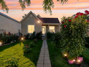 View of front of house with a yard