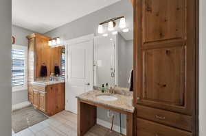 Main ensuite w/curbless walk-in shower separate vanities