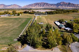 Birds eye view of property with a mountain view