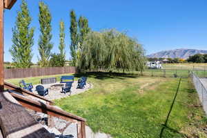 View of yard with a fire pit, a patio area, and a mountain view