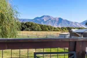 Property view of mountains with a rural view