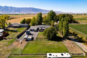 Birds eye view of property with a rural view and a mountain view