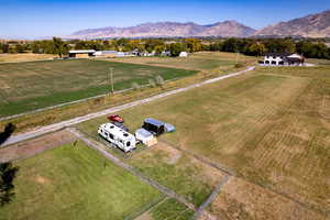 Birds eye view of property with a mountain view and a rural view